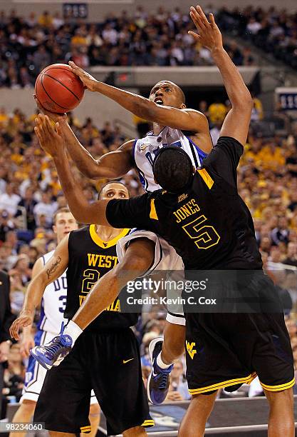 Nolan Smith of the Duke Blue Devils goes up for a shot against Kevin Jones of the West Virginia Mountaineers during the National Semifinal game of...