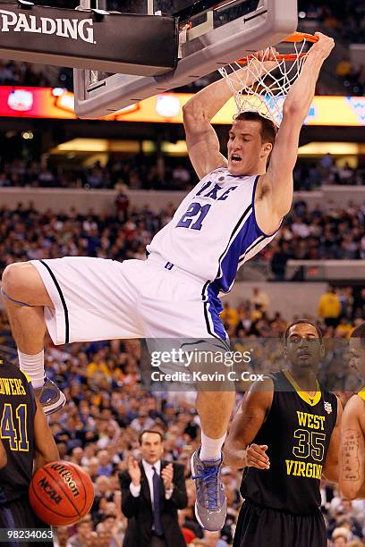 Miles Plumlee of the Duke Blue Devils dunks the ball as he is called for a technical foul for hanging on the rim in the second half against the West...