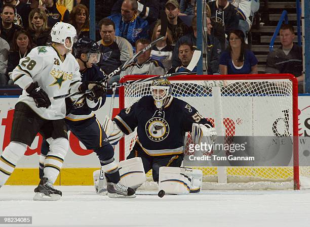 Andy McDonald and Chris Mason of the St. Louis Blues defend against Mark Fistric of the Dallas Stars on April 03, 2010 at Scottrade Center in St....