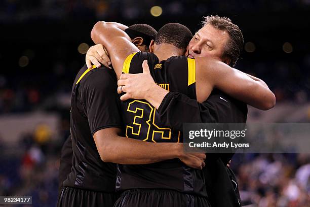 Kevin Jones, Wellington Smith and head coach Bob Huggins of the West Virginia Mountaineers console each other after they lost 78-57 against the Duke...