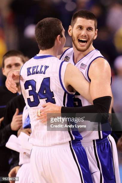 Ryan Kelly and Brian Zoubek of the Duke Blue Devils celebrate after their 78-57 win against the West Virginia Mountaineers during the National...