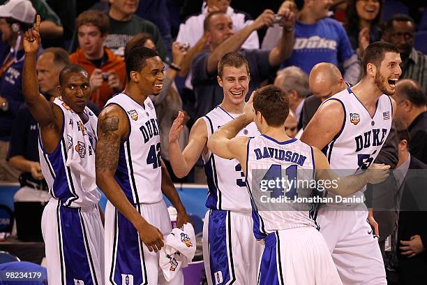 Nolan Smith, Lance Thomas, Jon Scheyer, Jordan Davidson and Brian Zoubek of the Duke Blue Devils react late in the second half before the Blue Devils...