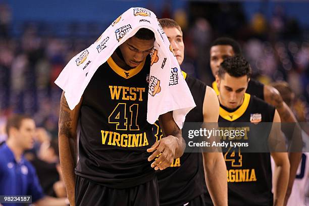 John Flowers of the West Virginia Mountaineers walks off the court dejected after they lost 78-57 against the Duke Blue Devils during the National...