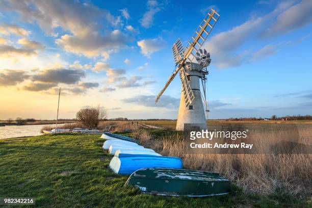 late light at thurne dyke drainage mill - norfolk broads stock pictures, royalty-free photos & images