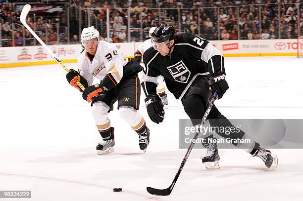 Alexander Frolov of the Los Angeles Kings skates with the puck against James Wisniewski of the Anaheim Ducks on April 3, 2010 at Staples Center in...