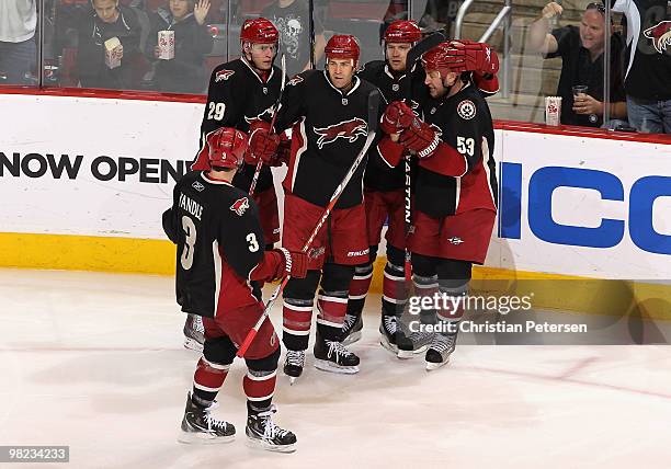 Keith Yandle, Lauri Korpikoski, Daniel Winnik, Petteri Nokelainen and Derek Morris of the Phoenix Coyotes celebrate after Winnik scored a second...