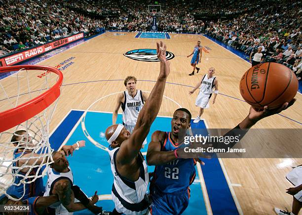 Jeff Green of the Oklahoma City Thunder goes in for the layup against Erick Dampier of the Dallas Mavericks during a game at the American Airlines...