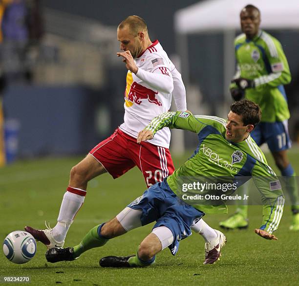 Zach Scott of the Seattle Sounders FC battles Chris Albright of the New York Red Bulls on April 3, 2010 at Qwest Field in Seattle, Washington.