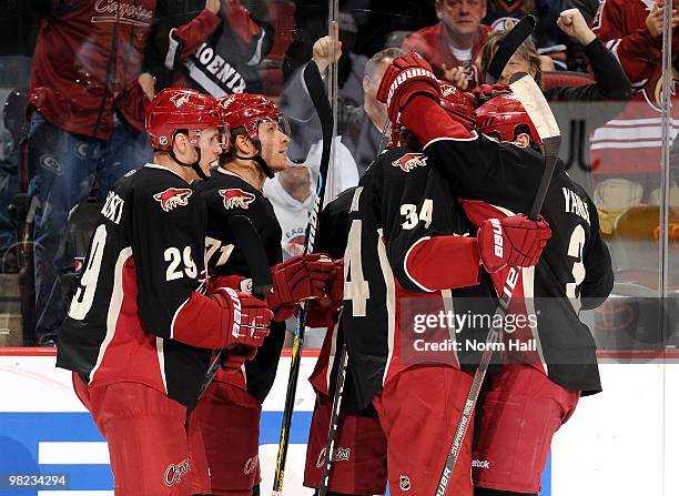 Daniel Winnik, Keith Yandle, Lauri Korpikoski and Petteri Nokelainen of the Phoenix Coyotes celebrate a goal against the Edmonton Oilers on April 3,...