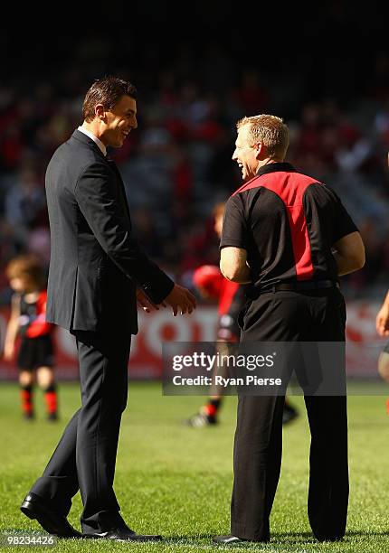 Former Essendon Champion Matthew Lloyd speaks with Matthew Knights, coach of the Bombers, before the round two AFL match between the Essendon Bombers...