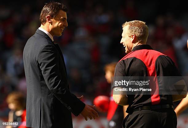 Former Essendon Champion Matthew Lloyd speaks with Matthew Knights, coach of the Bombers, before the round two AFL match between the Essendon Bombers...