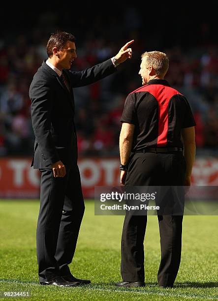 Former Essendon Champion Matthew Lloyd speaks with Matthew Knights, coach of the Bombers, before the round two AFL match between the Essendon Bombers...