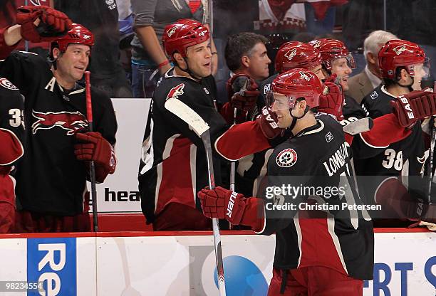 Matthew Lombardi of the Phoenix Coyotes celebrates with teammates on the bench after scoring a shootout goal against the Edmonton Oilers during the...