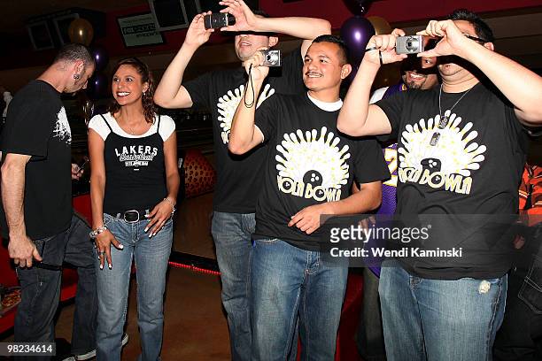 Fans take photos of Josh Powell of the Los Angeles Lakers during the HOLA Bowla event held on April 3, 2010 at Pinz Bowling Alley in Studio City,...