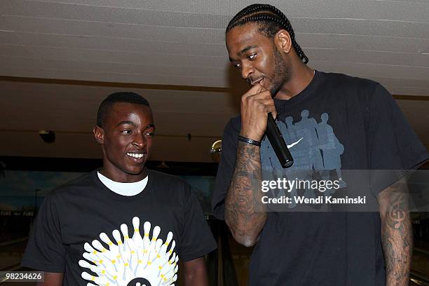 Josh Powell of the Los Angeles Lakers talks to the winner of the raffle during the HOLA Bowla event on April 3, 2010 at Pinz Bowling Alley in Studio...