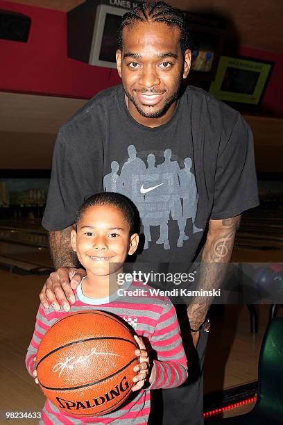 Josh Powell of the Los Angeles Lakers poses with Tarlton Walker after Josh wins a Kobe Bryant signed basketball in an auction. Josh donated the ball...