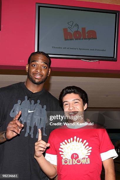 Josh Powell of the Los Angeles Lakers poses for a photo with a fan during the HOLA Bowla event on April 3, 2010 at Pinz Bowling Alley in Studio City,...