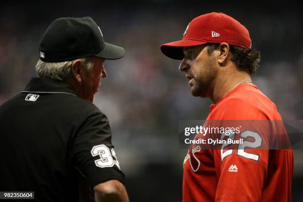 Manager Mike Matheny of the St. Louis Cardinals argues a call with umpire Mike Winters in the seventh inning against the Milwaukee Brewers at Miller...