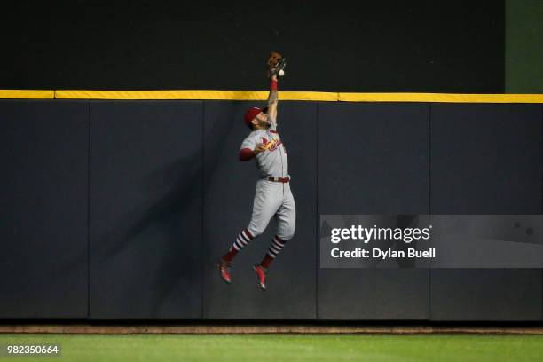 Tommy Pham of the St. Louis Cardinals fails to catch a fly ball in the seventh inning against the Milwaukee Brewers at Miller Park on June 21, 2018...