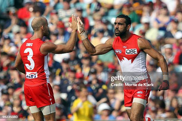 Jarrad McVeigh and Adam Goodes of the Swans celebrate a goal by Goodes during the round two AFL match between the Adelaide Crows and the Sydney Swans...