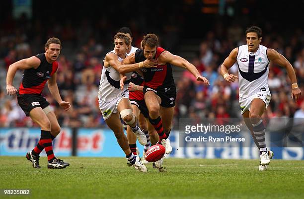 Jobe Watson of the Bombers competes for the ball against Stephen Hill of the Dockers during the round two AFL match between the Essendon Bombers and...
