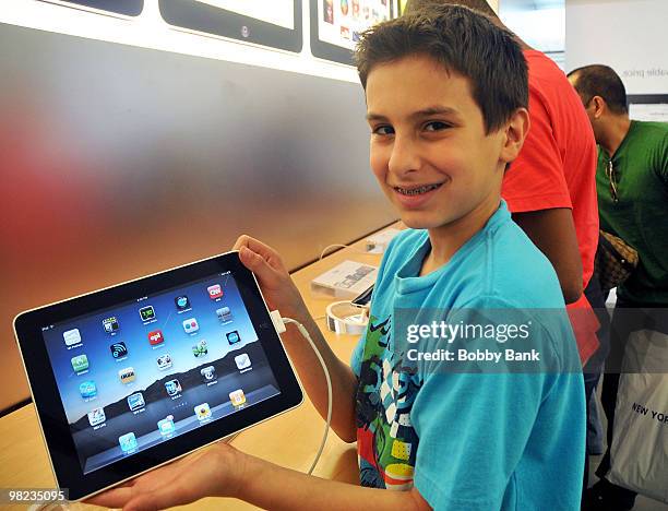 Customers inside the Apple Store try out the iPad in the Bridgewater Commions Mall in Bridgewater New Jersey on April 3, 2010. Debuting today, the...