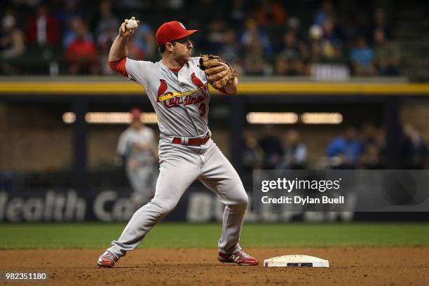 Jedd Gyorko of the St. Louis Cardinals turns a double play in the eighth inning against the Milwaukee Brewers at Miller Park on June 21, 2018 in...