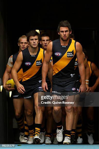 Chris Newman of the Tigers leads his players onto the ground during the round two AFL match between the Richmond Tigers and the Western Bulldogs at...