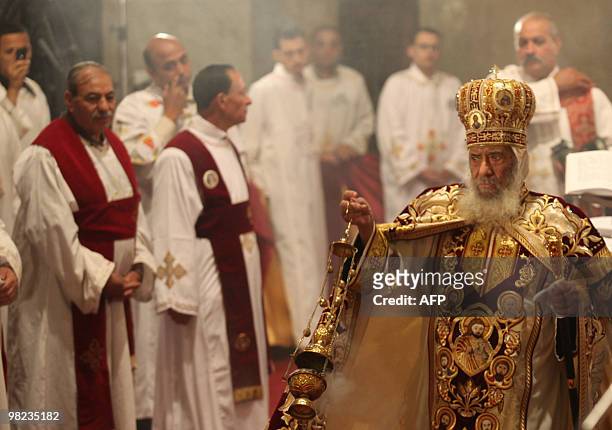 Pope Shenuda III spreads insence during Coptic Easter mass at Cairo's Abbassiya Cathedral in the early hours of April 4, 2010. The Coptic Orthodox...