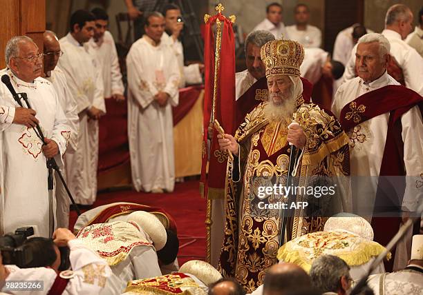 Pope Shenuda III leads the Coptic Easter mass at Cairo's Abbassiya Cathedral in the early hours of April 4, 2010. The Coptic Orthodox pope is the...