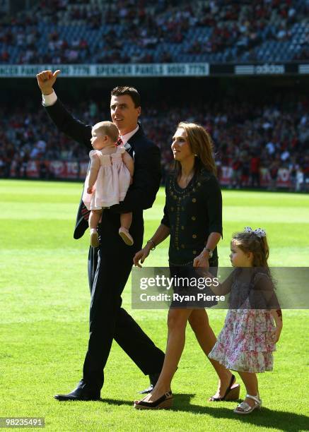 Former Essendon Champion Matthew Lloyd, his wife Lisa Lloyd and daughters Jaeda Lloyd and Kira Lloyd walk onto the ground as he is honoured before...