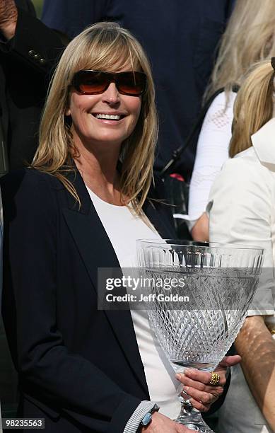 Actress Bo Derek presents a trophy to the winning owner's of Ventana after the 28th running of the Grade II Potrero Grande Handicap on April 3, 2010...