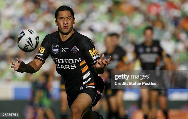 Benji Marshall of the Tigers passes the ball during the round four NRL match between the Canberra Raiders and the West Tigers at Canberra Stadium on...