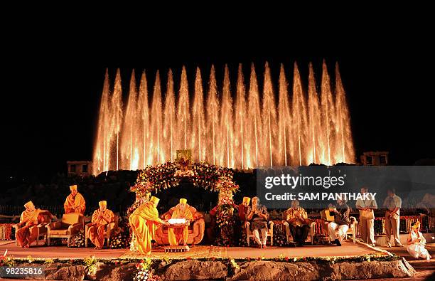 Officials including Chief Minister of the Indian state of Gujarat Narendra Modi applaud as Bochasanwasi Shri Akshar-Purshottam Swaminarayan...