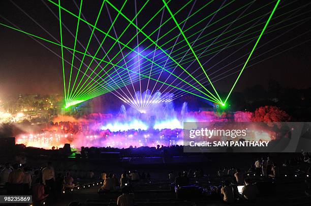 Officials watch a perfomance of The Sat-Chit-Anand Water Show at The Bochasanwasi Shri Akshar-Purshottam Swaminarayan Sansthan Akshardham in...