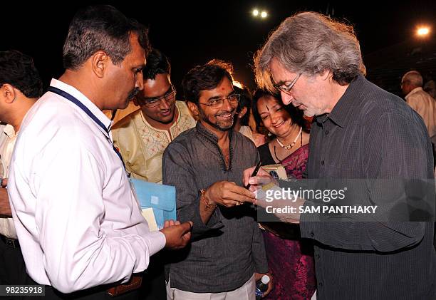 French creative director Yves Pepin signs autographs after the inaugural ceremony a perfomance of The Sat-Chit-Anand Water Show at The Bochasanwasi...