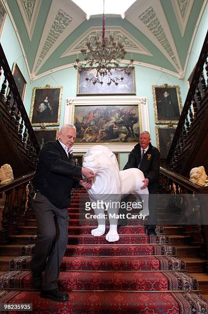 Longleat staff Mike Matthews and Steve Savage deliver a life size lion to Lord Bath which has been given to him by the Lions of Bath public art...