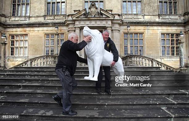 Longleat staff Mike Matthews and Steve Savage deliver a life size lion to Lord Bath which has been given to him by the Lions of Bath public art...