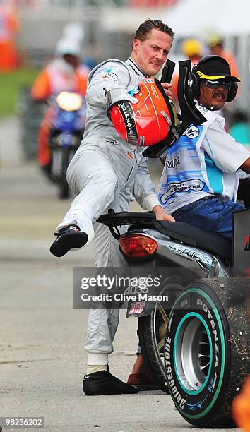 Michael Schumacher of Germany and Mercedes GP retires early from the Malaysian Formula One Grand Prix at the Sepang Circuit on April 4, 2010 in Kuala...