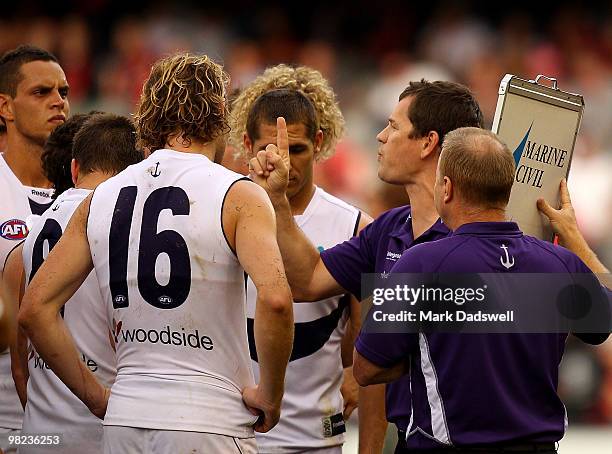 Mark Harvey coach of the Dockers addresses his players during the round two AFL match between the Essendon Bombers and the Fremantle Dockers at...