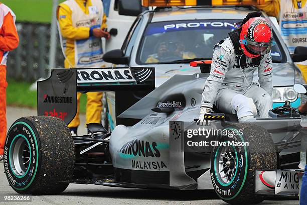 Michael Schumacher of Germany and Mercedes GP retires early after losing drive during the Malaysian Formula One Grand Prix at the Sepang Circuit on...