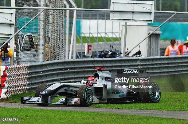 Michael Schumacher of Germany and Mercedes GP retires early after losing a wheel nut during the Malaysian Formula One Grand Prix at the Sepang...