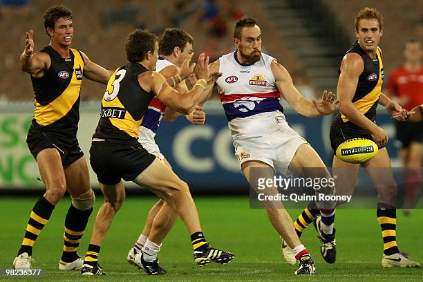 Ben Hudson of the Bulldogs kicks during the round two AFL match between the Richmond Tigers and the Western Bulldogs at the Melbourne Cricket Ground...