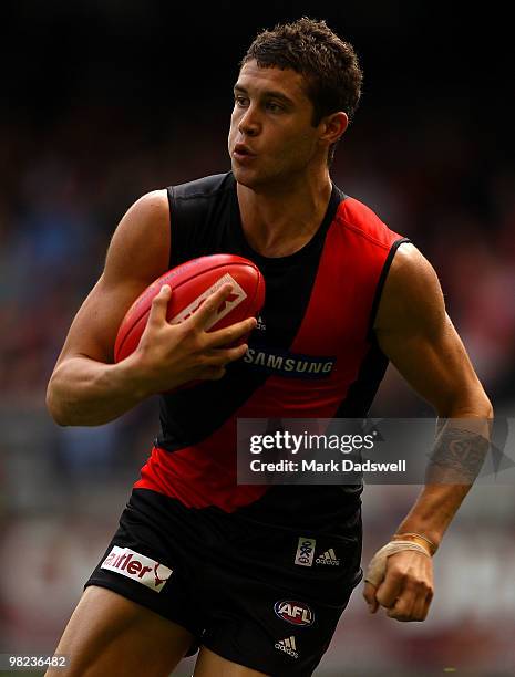 Tayte Pears of the Bombers gathers the ball during the round two AFL match between the Essendon Bombers and the Fremantle Dockers at Etihad Stadium...