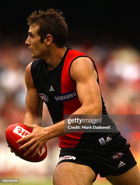 Jobe Watson of the Bombers gathers the ball during the round two AFL match between the Essendon Bombers and the Fremantle Dockers at Etihad Stadium...