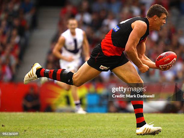 David Hille of the Bombers looks for a teammate during the round two AFL match between the Essendon Bombers and the Fremantle Dockers at Etihad...