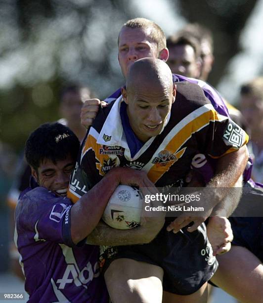 Tyran Smith of the West Tigers is tackled by Stephen Kearney of the Melbourne Storm during the Round 5 NRL Match between the West Tigers and the...