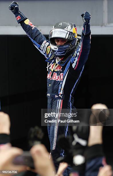 Sebastian Vettel of Germany and Red Bull Racing celebrates in parc ferme after winning the Malaysian Formula One Grand Prix at the Sepang Circuit on...