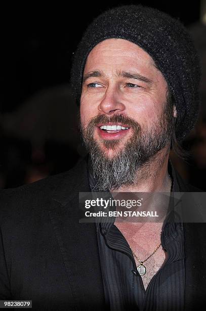 Actor and director Brad Pitt poses as he arrives to the European premiere of new movie "Kick-Ass" in London on March 22, 2010. AFP PHOTO/ BEN STANSALL