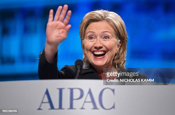 Secretary of State Hillary Clinton waves as she takes the stage to address the annual American Israel Public Affairs Committee policy conference in...